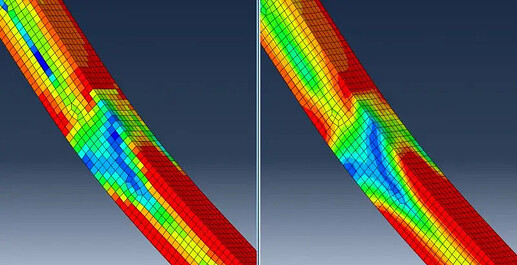图片展示了使用有限元分析模拟的弯曲梁的应力分布图，颜色代表不同程度的应力大小。 (由 AI 生成标题)